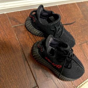 Black Yeezy toddler sneakers.